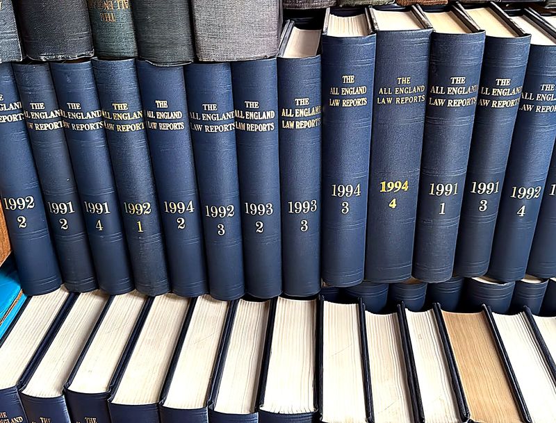 Bound volumes of the All England Law Reports from the early 1990s, sorted for collection.